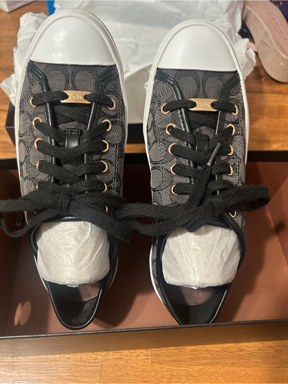 Coach Black Signature Canvas Low-Top Sneaker with White Toe Cap and Gold Accents